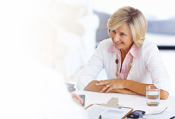 Woman beginning a hearing test interview